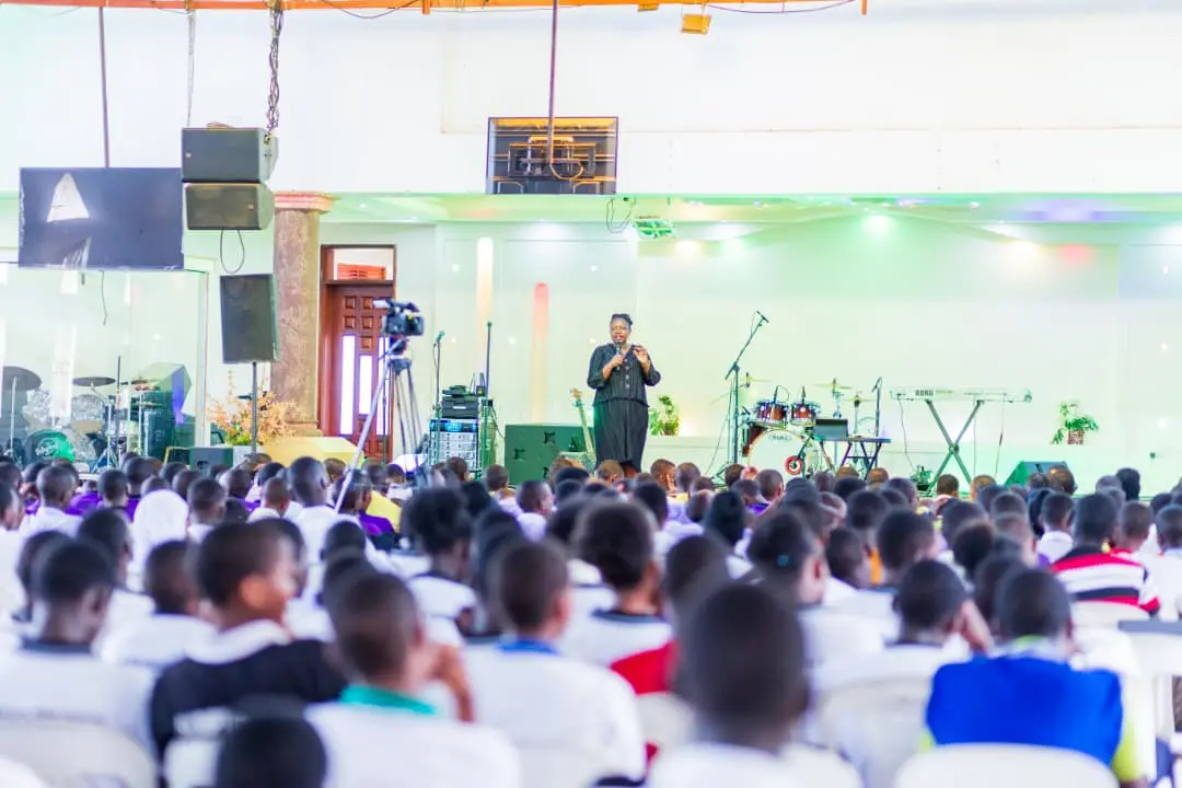 Coach Monica Opio addressing students at a conference